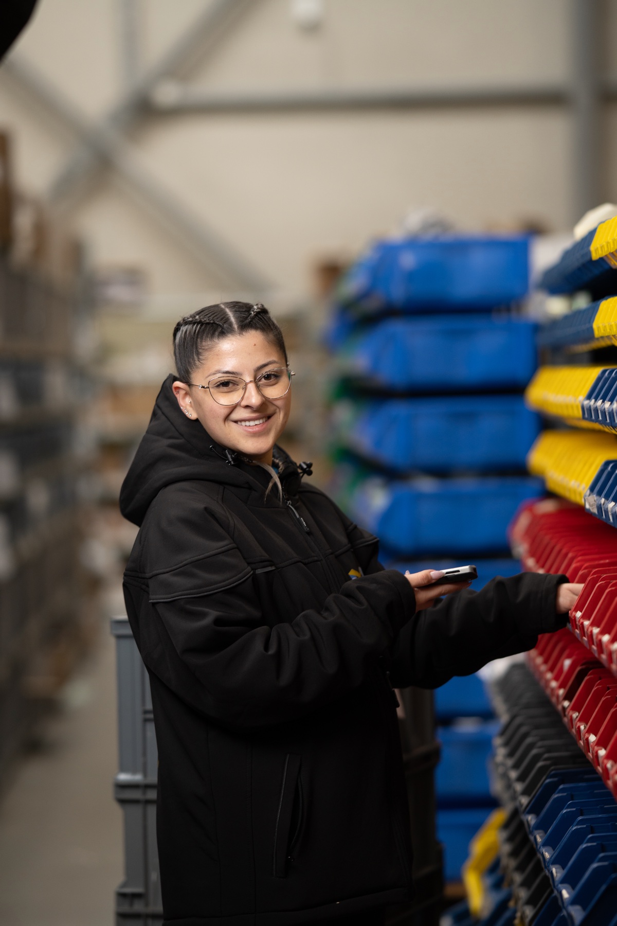 Warehouse zone at the BigArena fulfillment center - colored shelves for processing online orders