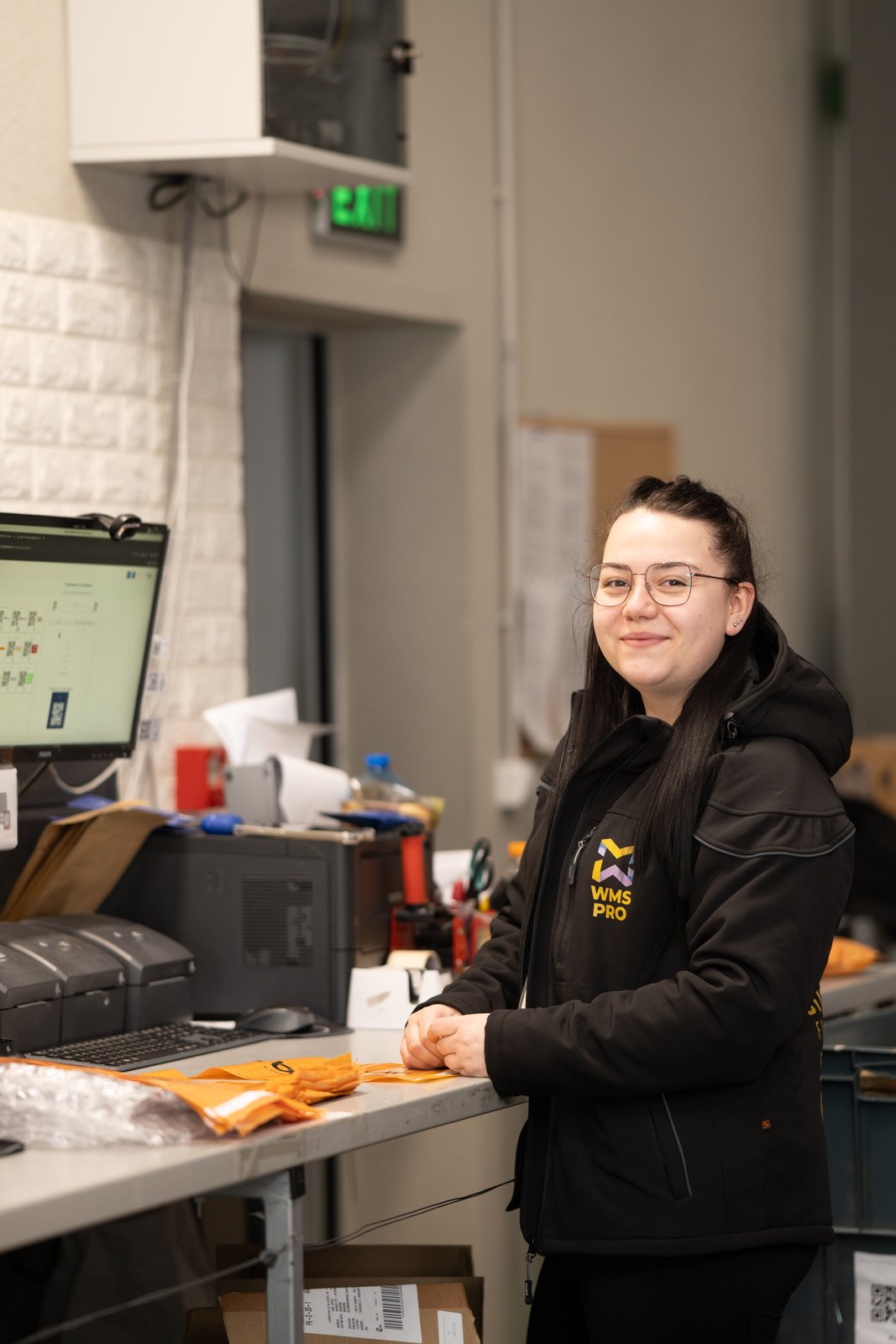 Pick and pack operation at the BigArena fulfillment center - operator picks SKU for an order